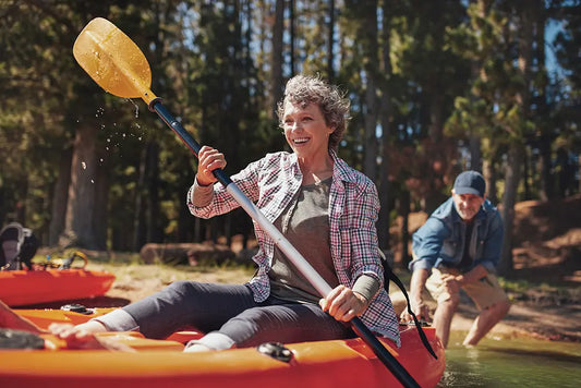 Woman sitting in an inflatable kayak